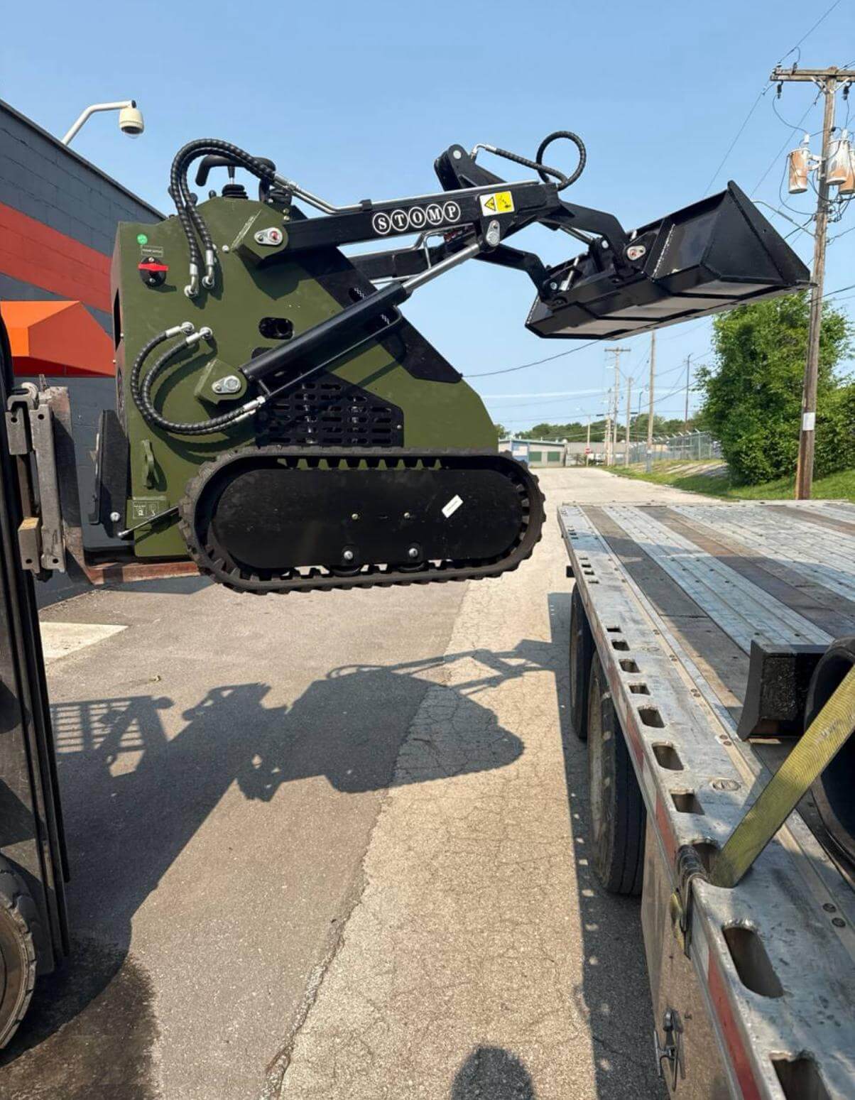 Blue construction equipment delivery