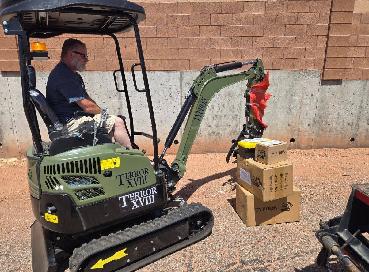 Yellow excavator at construction site